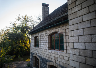 Beautiful landscape village house with trees at the forest during autumn, Azerbaijan