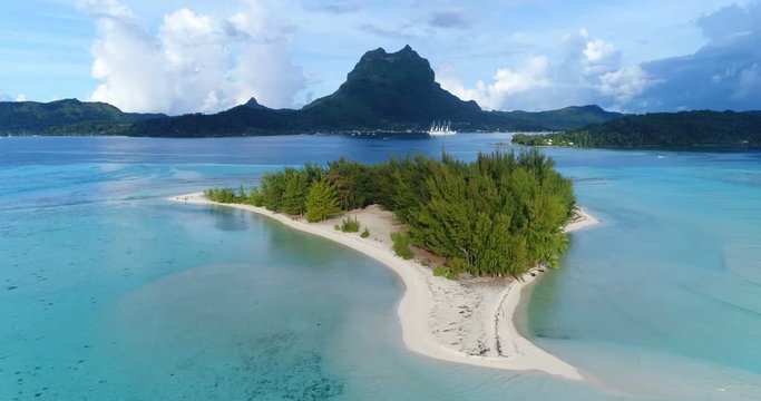Small Island in Vacation Paradise By Turquoise Sea On Sunny Day Travel, vacation and summer holiday concept.