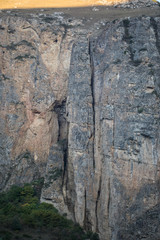 Majestic landscape of mountains and Meadow. Cycling mountain road. Misty mountain road in high mountains.. Cloudy sky with mountain road.