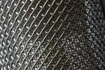 Macro photograph of a microphone. Screen of a mic