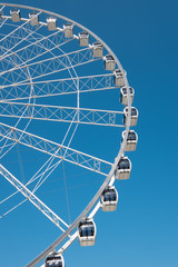 Large Ferris wheel against a clear blue sky