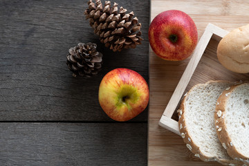 Breakfast served with bread and apple on the wood table. Health breakfast