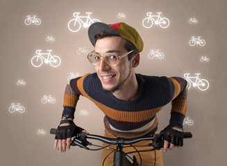 Young ridiculous biker with line drawn bikes on the background