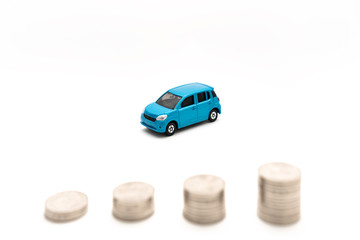 Cars and coins in white background 