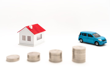Concept pictures of houses, cars and coins