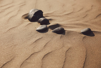 Fototapeta na wymiar Rock In Sand