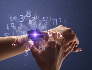 Close up female naked hand wearing smartwatch and numbers around