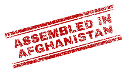 ASSEMBLED IN AFGHANISTAN seal print with corroded texture. Red vector rubber print of ASSEMBLED IN AFGHANISTAN title with dirty texture. Text title is placed between double parallel lines.