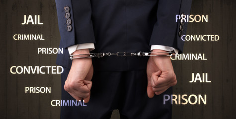 Jail convicted prison criminal labels with close handcuffed man

