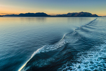 Beautiful morning light and water ripples from ship's wake, Alaska, USA.