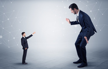 Small businessman aiming at a big businessman with connection and network concept
