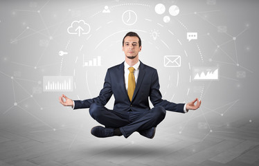 Elegant calm businessman levitates in yoga position with data circulation concept
