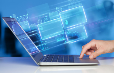 Hand using laptop with database reports and online work concept
