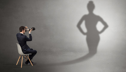 Rich businessman staying and offering stuffs to a pretty shadow woman
