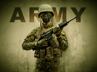 Uniformed armed soldier with damaged wall background
