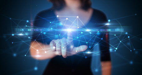 Woman touching hologram screen displaying modern web system
