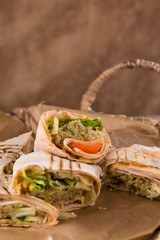 Pieces of vegetarian falafel roll on a wicker tray. Serving dishes.. Traditional Middle Eastern snack. Fastfood.