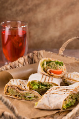Pieces of vegetarian falafel roll on a wicker tray. Serving dishes.. Traditional Middle Eastern snack. Fastfood.