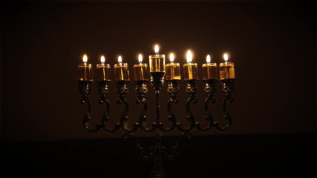 Jewish holiday of Hanukkah. Stop motion of the menorah candles light from 1st to 8th day.