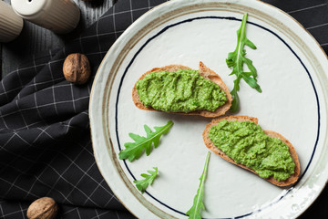 Bruschetta with garden rocket pesto, a vegan snack.