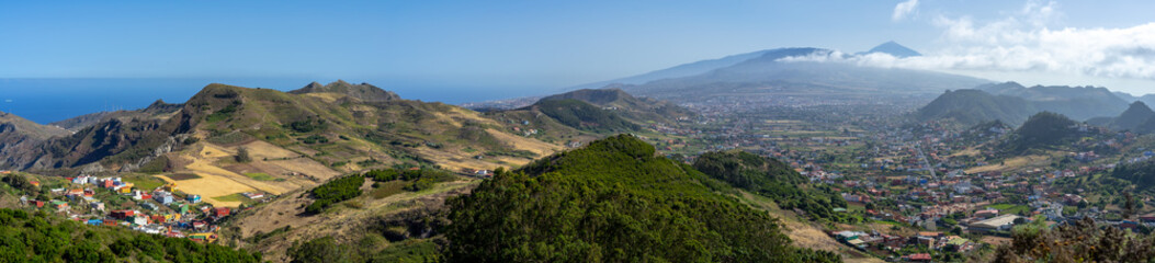 Fototapeta na wymiar Panoramic view of the valley, the old capital of the island of San Cristobal de La Laguna and the volcano Teide. Tenerife. Canary Islands. Spain. View from the observation deck - Mirador De Jardina.