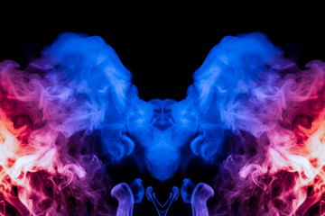 A dynamic explosion of puffs of smoke of light blue pink and red colors on a black background with smooth fire rendering an isolated pattern in the form of a bird.
