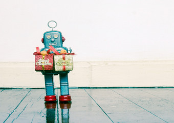 retro robots  with gifts on a old wooden floor