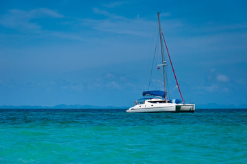 Small yacht  in the sea with blue sky