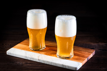 a glass of beer  on wooden background