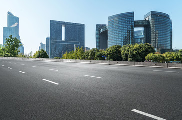 Fototapeta premium Empty road floor surface with modern city landmark buildings of hangzhou bund Skyline,zhejiang,china