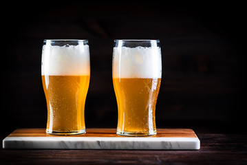 a glass of beer  on wooden background