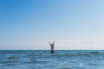 boy in the snorkeling mask dives in the sea wave. Travel and summer concept