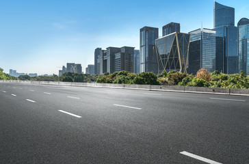 Obraz premium Empty road floor surface with modern city landmark buildings of hangzhou bund Skyline,zhejiang,china