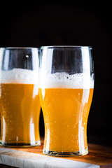 a glass of beer  on wooden background