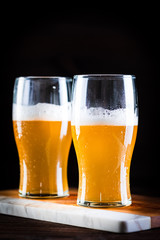 a glass of beer  on wooden background