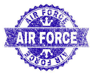 AIR FORCE rosette seal watermark with grunge style. Designed with round rosette, ribbon and small crowns. Blue vector rubber watermark of AIR FORCE title with grunge texture.