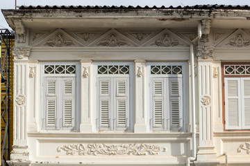 Phuket old town : Sino-Portuguese Architecture buildings. This architectural style is European mixed with Chinese modern, Thailand. Ancient window.
