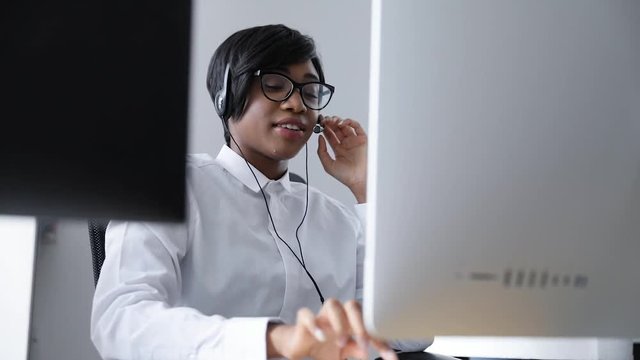 Customer Support. Afro-American Woman Working In Call Center