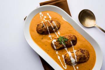 Malai Kofta Curry is a Mughlai special recipe served in a bowl. Selective focus