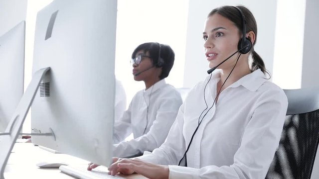 Call Center. Smiling Woman In Headset Working At Computer