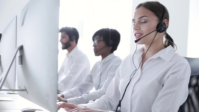 Call Center. Smiling Woman In Headset Working At Computer