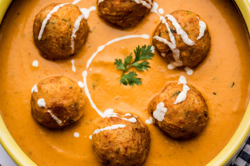 Malai Kofta Curry is a Mughlai special recipe served in a bowl. Selective focus