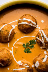 Malai Kofta Curry is a Mughlai special recipe served in a bowl. Selective focus