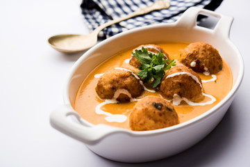 Malai Kofta Curry is a Mughlai special recipe served in a bowl. Selective focus