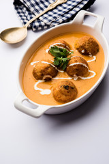 Malai Kofta Curry is a Mughlai special recipe served in a bowl. Selective focus