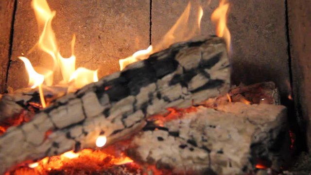 Firewood burning in a fireplace