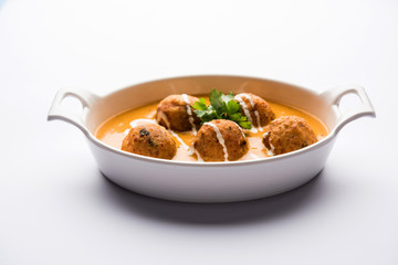 Malai Kofta Curry is a Mughlai special recipe served in a bowl. Selective focus