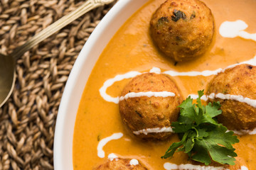 Malai Kofta Curry is a Mughlai special recipe served in a bowl. Selective focus