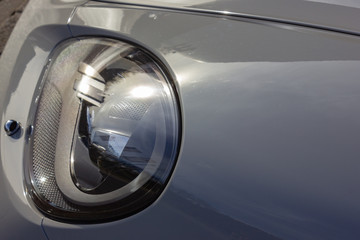details of german sportscar body work with raindrops
