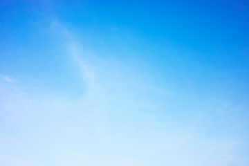 Naklejka na ściany i meble Fluffy blue sky background and white clouds soft focus, and copy space